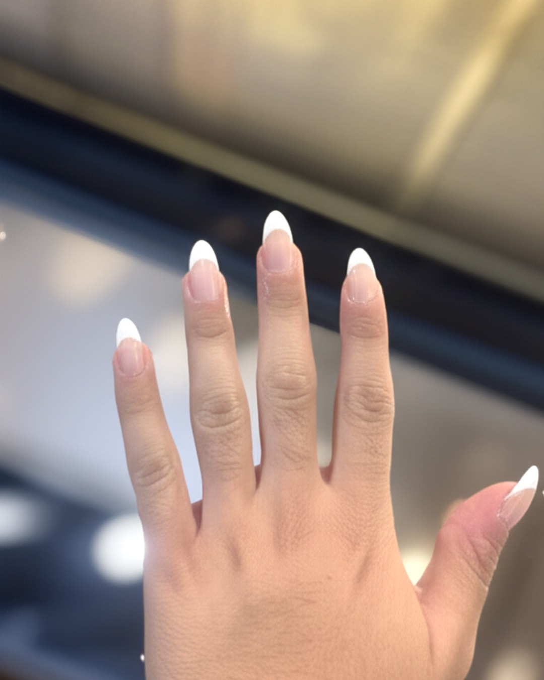 white french tip nails with natural base, almond shape, long length, glossy finish