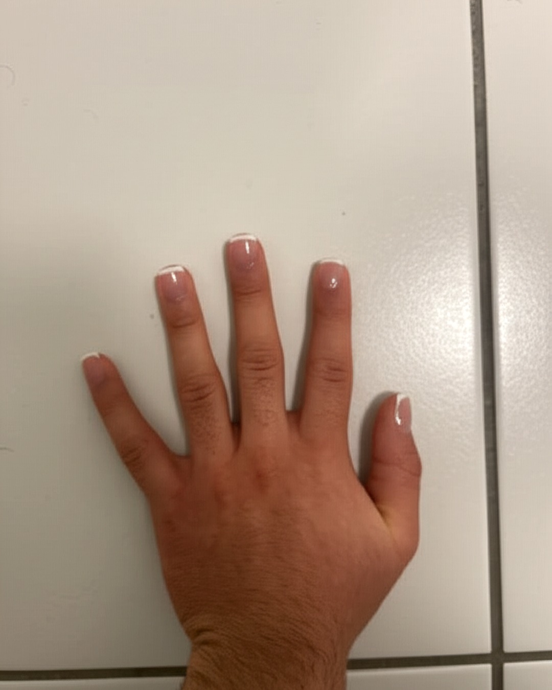 white french tip nails with natural base, square shape, medium length, glossy finish