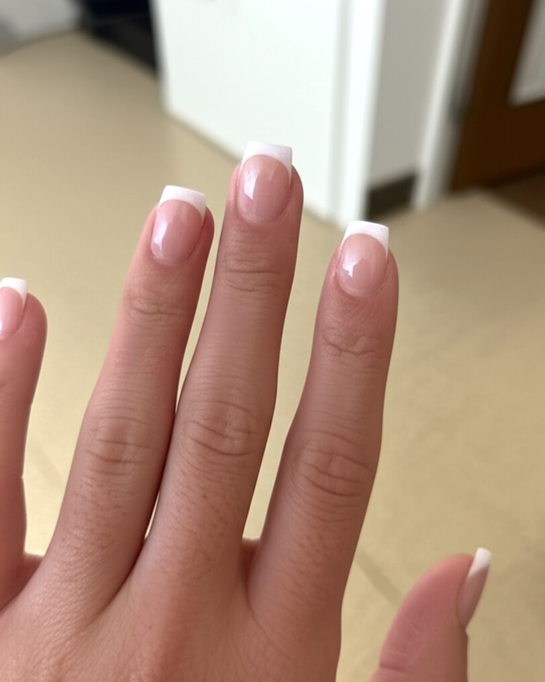 white french tip nails with nude base, square shape, medium length, glossy finish