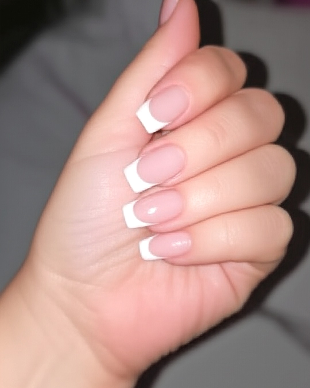 white coffin French Tip Nails - medium glossy white french tip nails with milky-white base, coffin shape, medium length, glossy finish