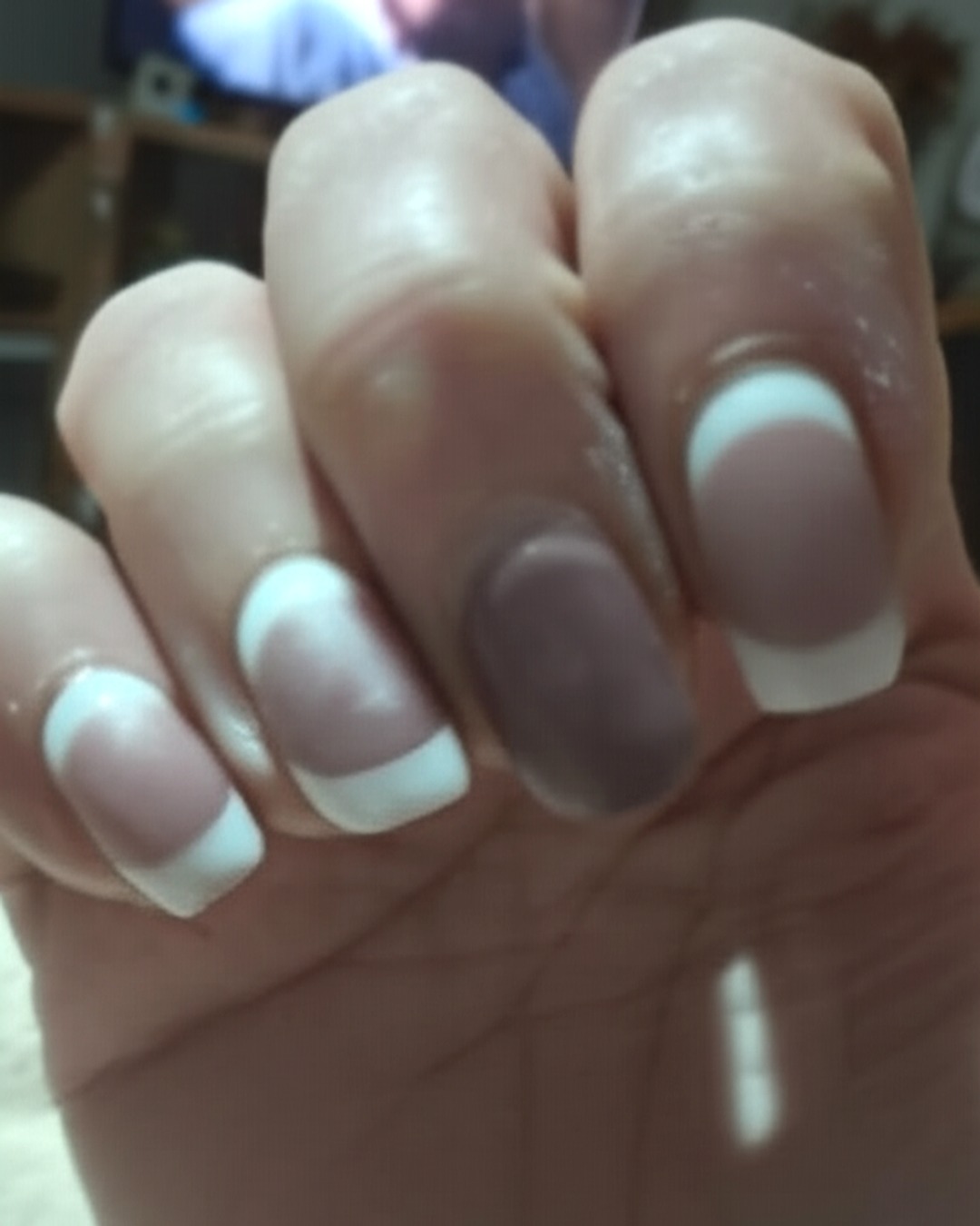 white french tip nails with natural base, almond shape, medium length, glossy finish