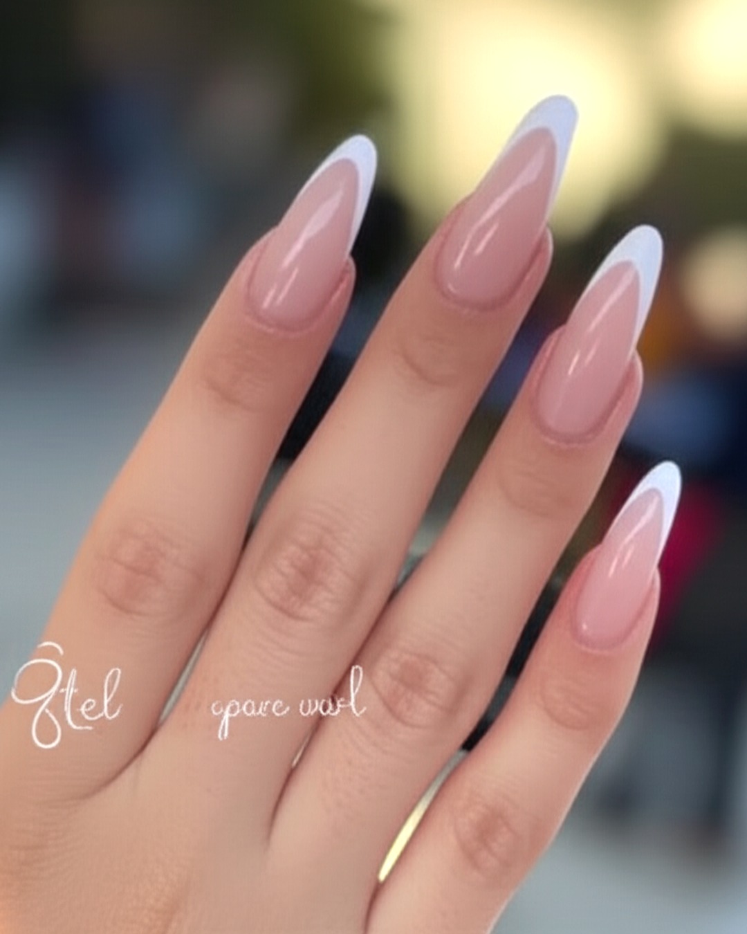 white stiletto French Tip Nails - extra-long glossy white french tip nails with natural base, stiletto shape, extra-long length, glossy finish