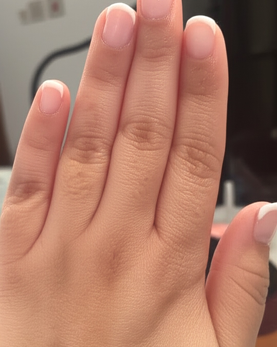 white french tip nails with milky-white base, almond shape, medium length, glossy finish