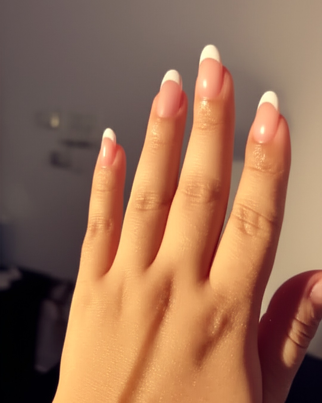 white french tip nails with natural base, almond shape, medium length, glossy finish